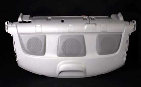 A finished molded part, white in colour.